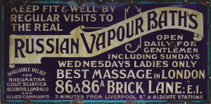 Metal Russian Vapour Baths sign. Dark purple with gold lettering