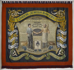 Fabric hanging banner with image of a baker shaking hands with another man