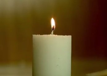 Close up image of a lighted candle flame