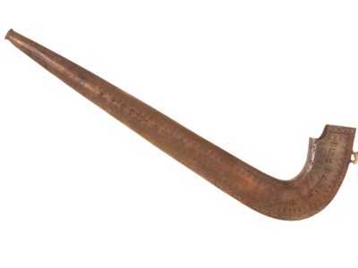Shofar, blow piece on left, carved with foliage patterns and hebrew writing