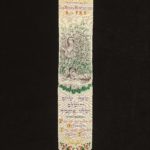 Narrow bookmark with image of Miriam and baby Moses woven on. Hebrew and English writing woven at the bottom of the bookmark.