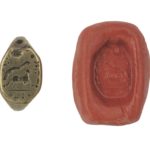 A wax seal with the design of a snake and ram inscribed in Hebrew