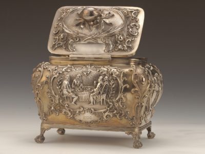 silver box with engraved scenes