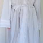 Photo of white long-sleeved robe with white belt.