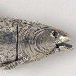 Detail of movable mouth of the silver fish shaped spice box