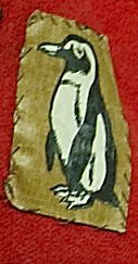 A red cloth with a penguin on it